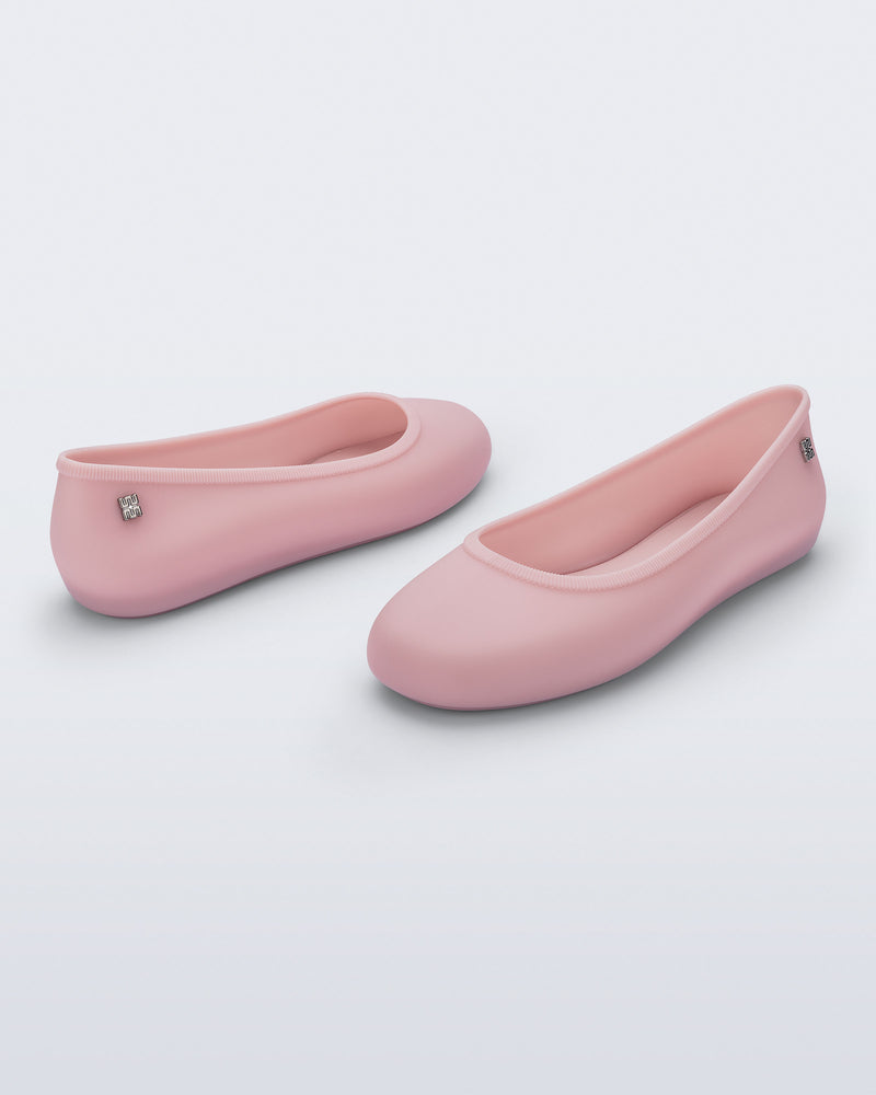 Back and angled view of a pair of pink Soft Ballerina Essential flats