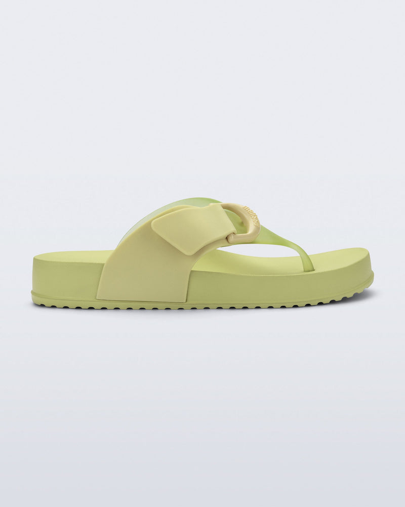 Side view of a green Cozy Thong Flip Flop