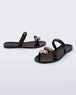 Side and angled view of a pair of brown Eden sandals with metallic upper accents