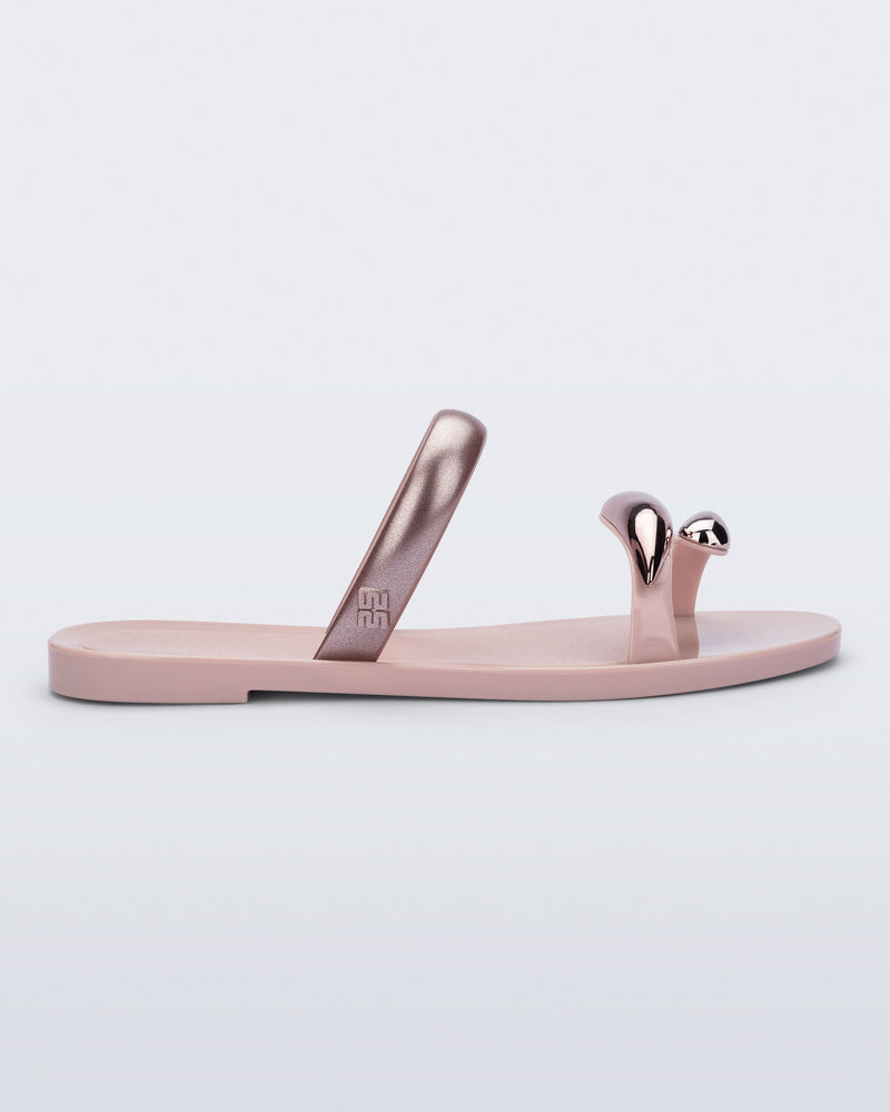 Side view of a pink Eden sandal with metallic