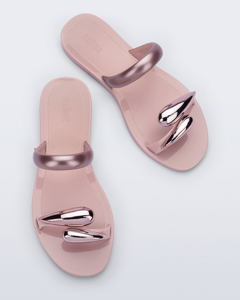 Top view of a pair of pink Eden sandals with metallic