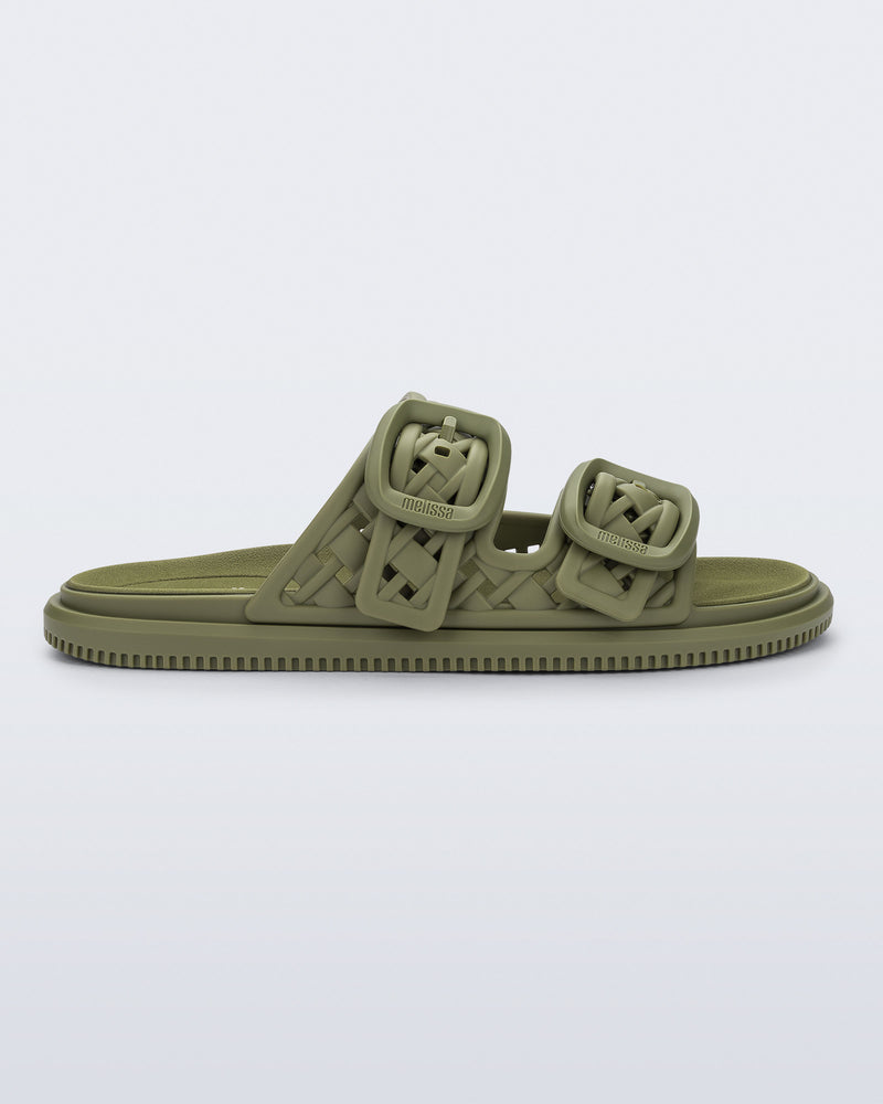 side view of a matte green Possession Slip sandal with two straps with buckles