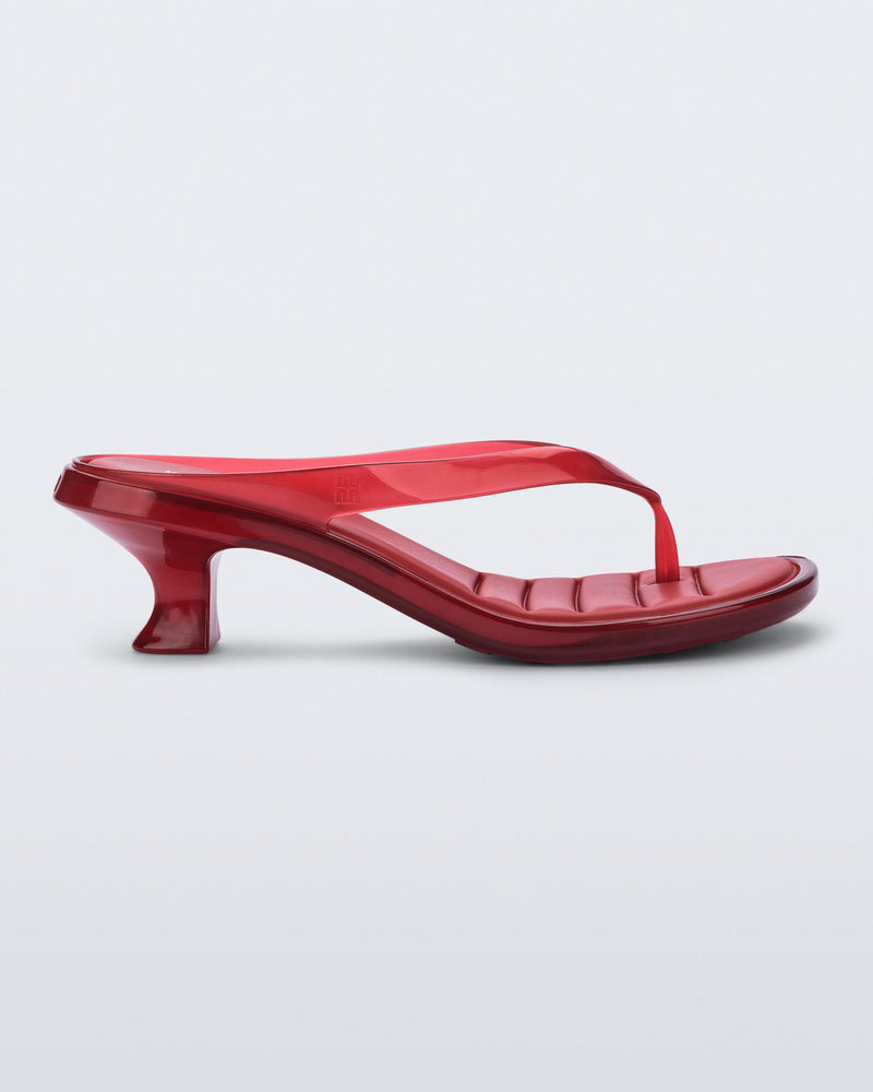 Side view of a transparent red Flip Flop Kitten Heel