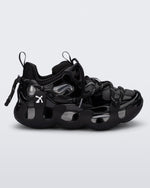 Side view of a black with grey accents Melissa X Icon sneaker