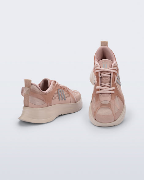 Back angle and top view of a pair of pink Melissa X Beat sneakers on a light gray background