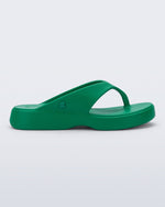 Side view of a green Free Thong Low flip flop