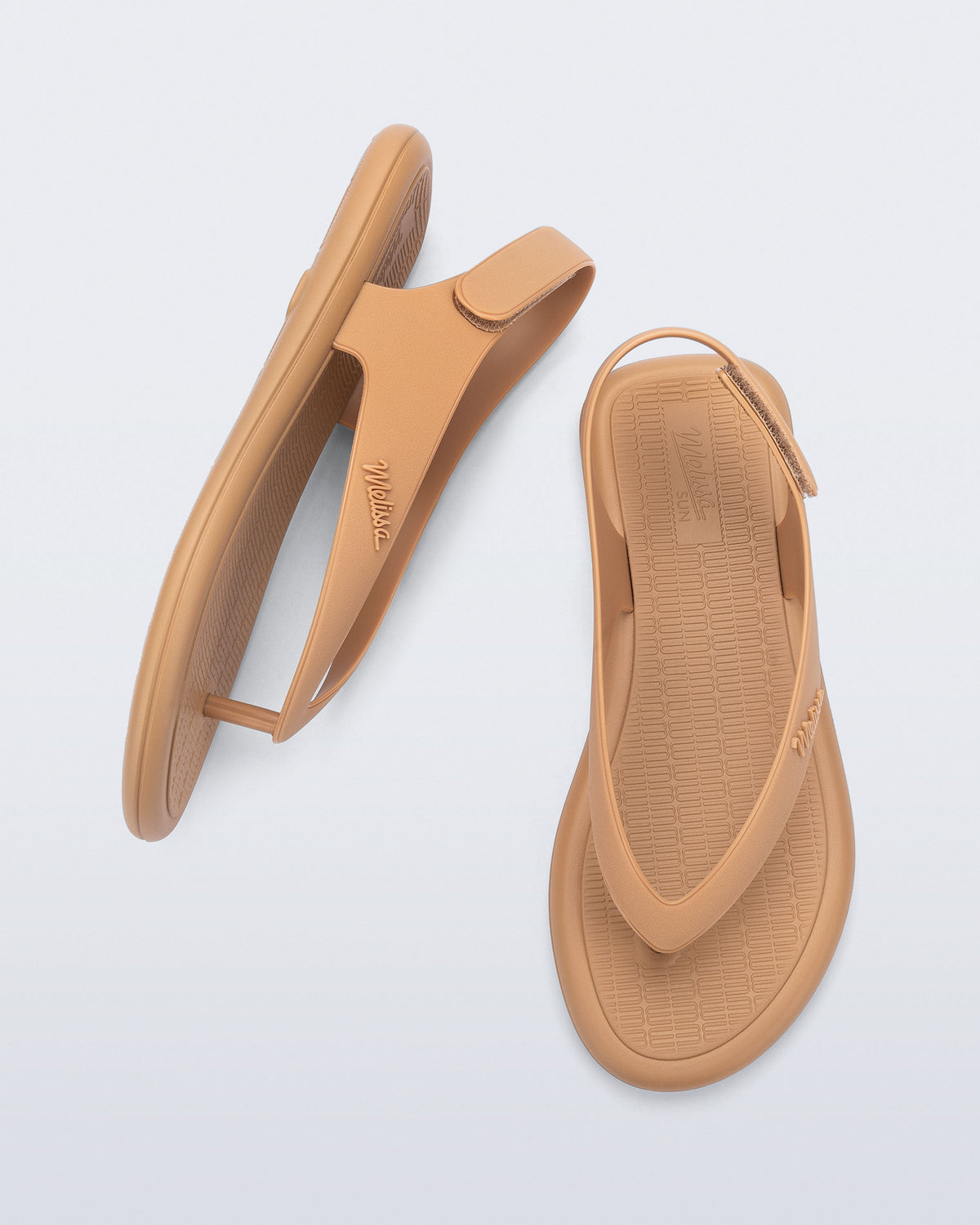 Side and top view of a pair of dark beige Sun Samba thong sandals