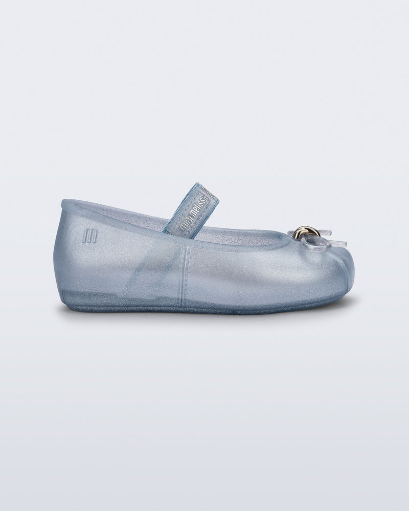 Side view of a pearly blue Sophie baby ballerina flat with bow