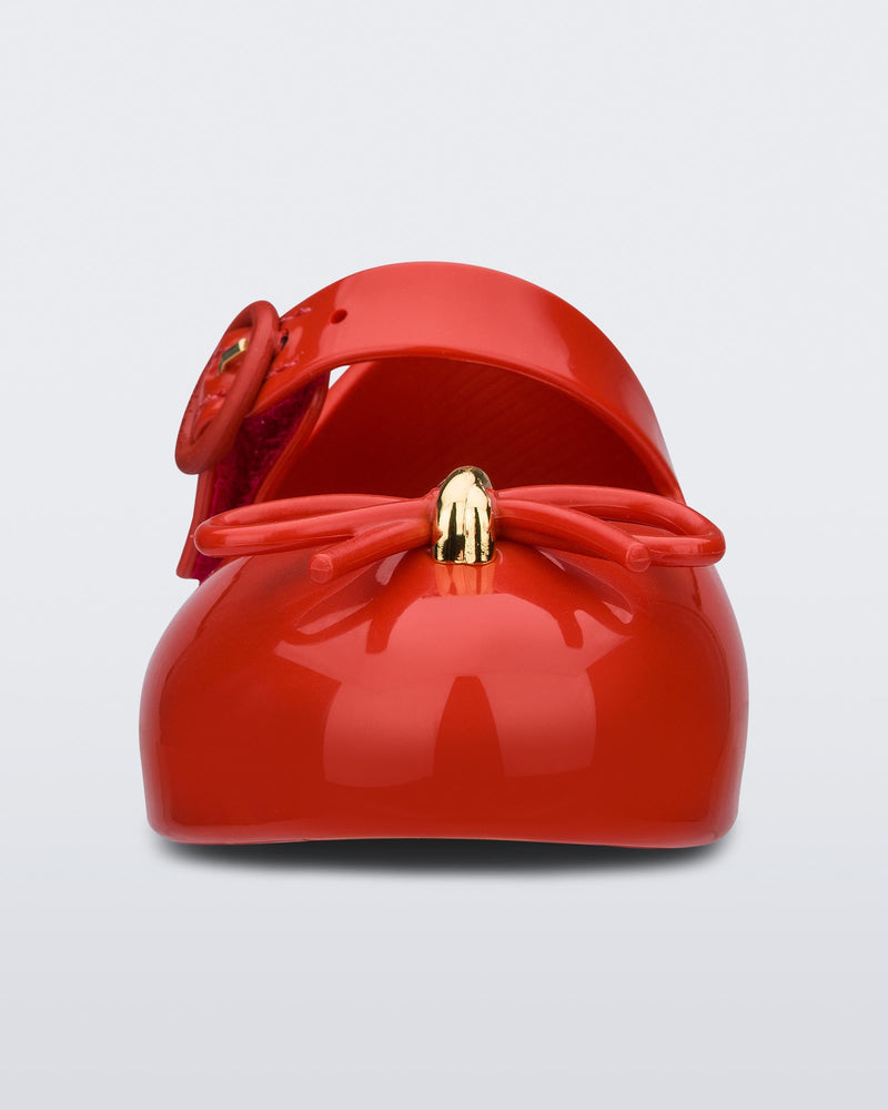 Front view of a red Sweet Love baby ballerina with red bow