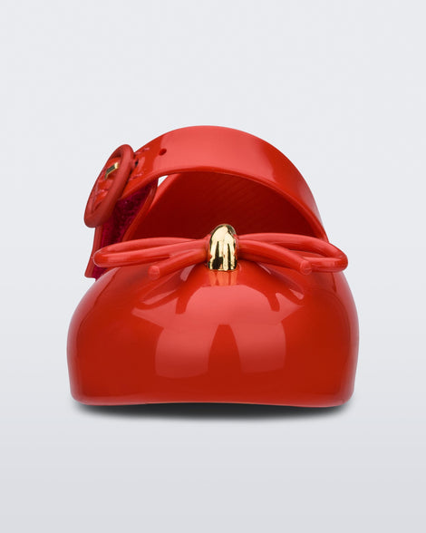 Front view of a red Sweet Love baby ballerina with red bow