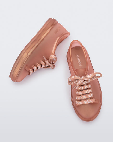 Top and side view of a pair of pearly brown Hip M Lover kids sneakers with laces.