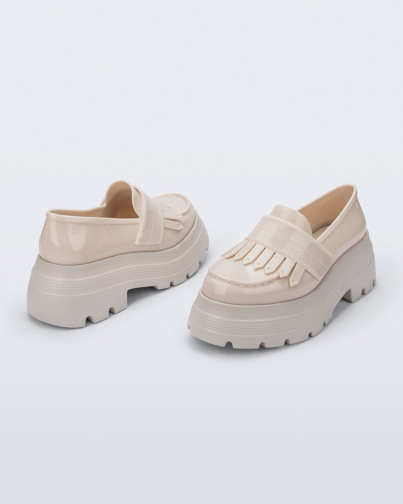 Back and angled view of a pair of beige Royal Plus Platform loafers