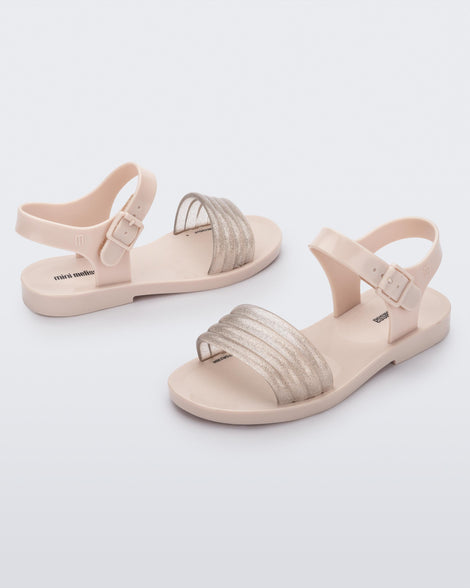 Angled view of a pair of beige Mar Wave kids sandals.