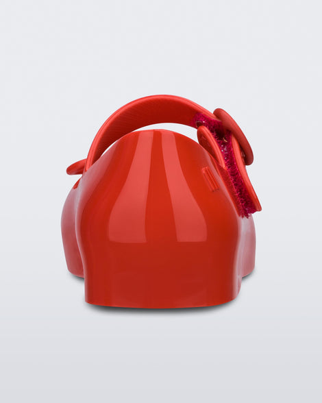 Back view of a red Sweet Love baby ballerina with red bow