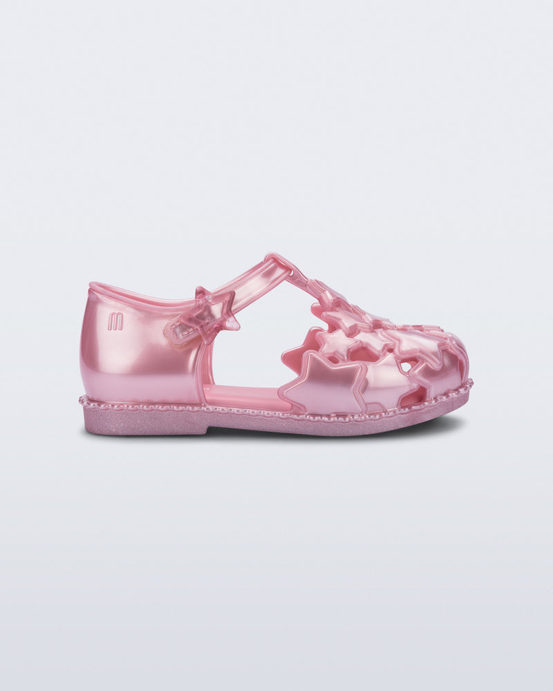 Side view of a pearly pink Starry baby sandal