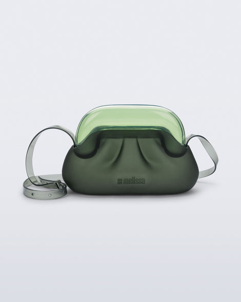 Front view of a small green bag with clear green clutch and long strap