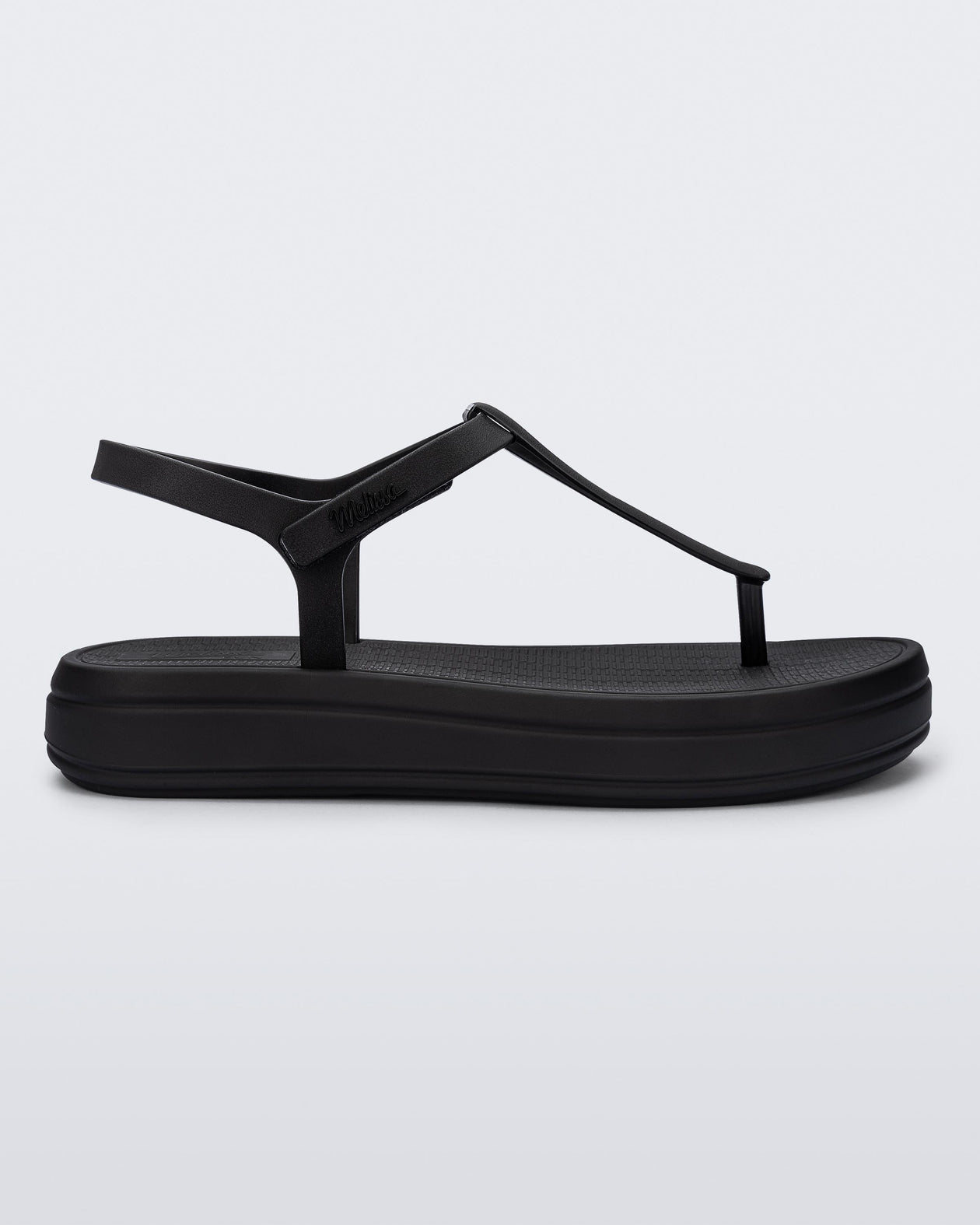 Side view of a black Sun Leme Platform sandal