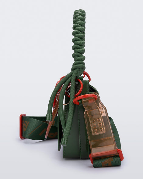 Side view of an dark green Olga Bag + Alexandre Pavao with short strap fabric long strap