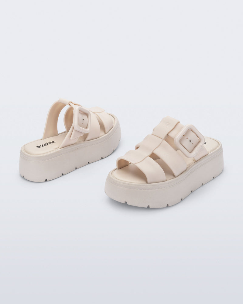 Back and angled view of a pair of beige Pump Platform sandals