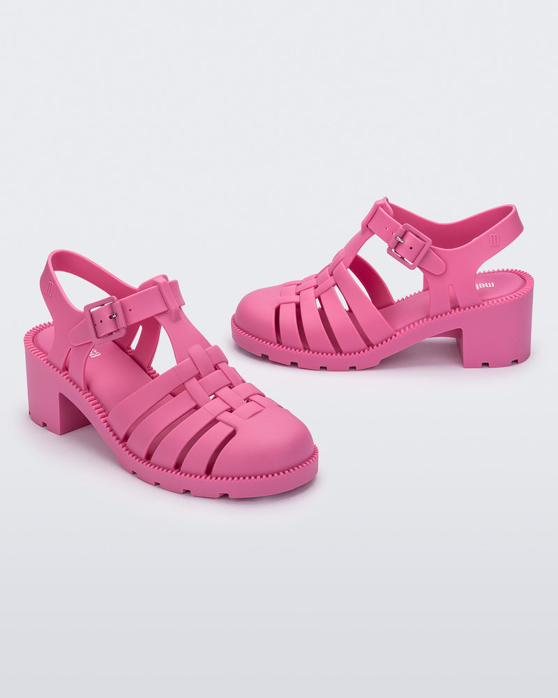 Angled view of a pair of pink Possession Heel women's fisherman style sandals.