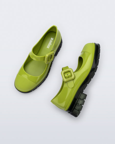 Top and side view of a pair of green with black sole June mary janes with matte toe cap