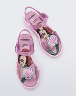 Top view of a pair of glitter pink Mini Melissa Mar Sandal Princess sandals with a seashell detail on the front strap, an ankle strap and Princess Ariel soul