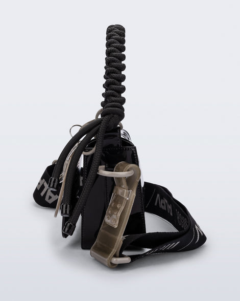Side view of an black Olga Bag + Alexandre Pavao with short strap fabric long strap