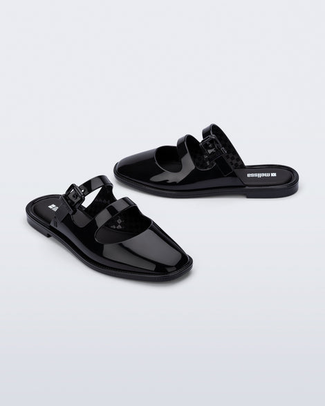 Side and angled view of a pair of black Anastasia mule slides