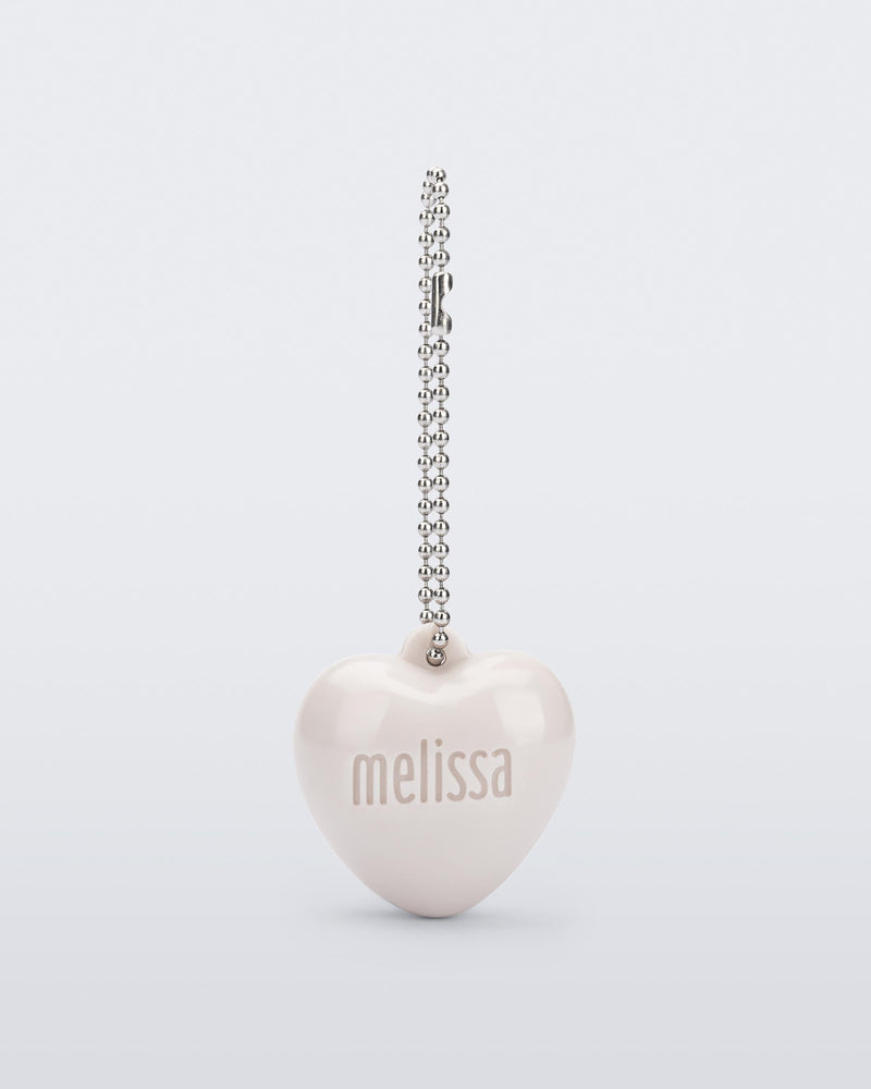 Front view of a beige Heart Charm