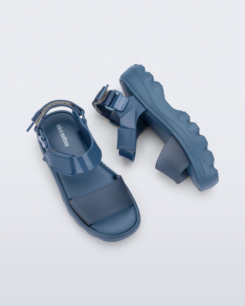 Side and top view of a pair of blue Kick Off kids sandals
