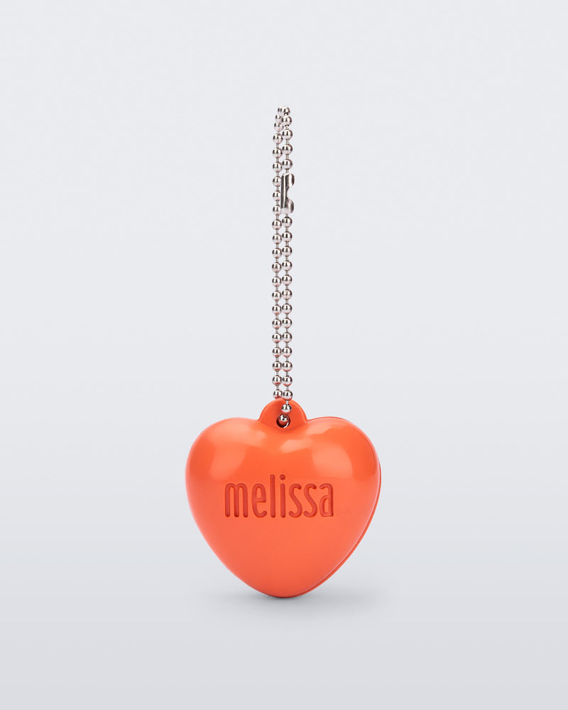 Front view of an orange Heart Charm