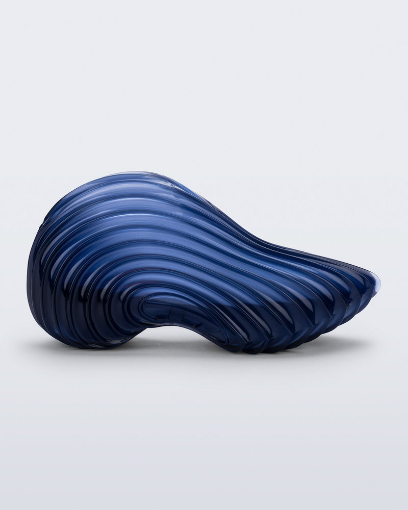 Side view of a clear blue Quantum Sneaker