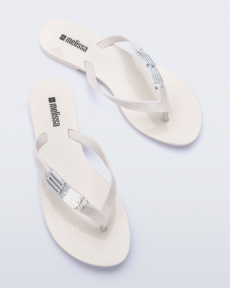 Top view of a pair of white Harmonic M Chic