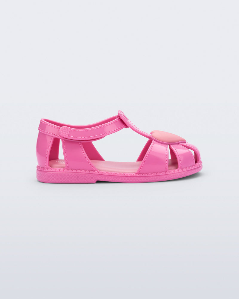 Side view of a pink Hip Heart Ballerina baby sandal with heart on front