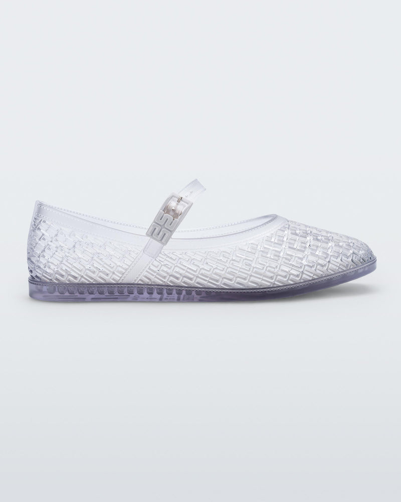 Side view of a clear Harper ballerina flat with top strap with buckle