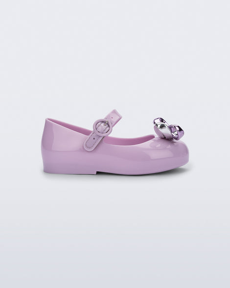 Side view of a lilac Sweet Love Glam baby ballerina with bow