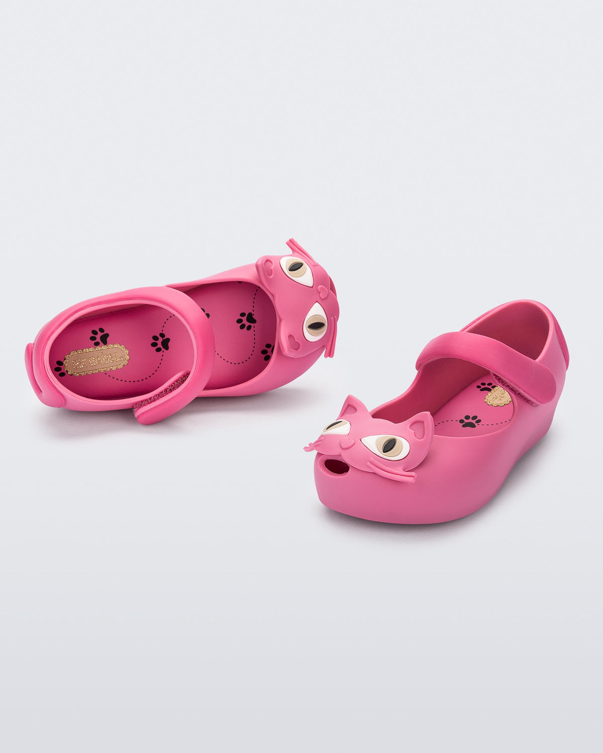 Top and angled view of a pair of pink Ultragirl Cat baby flats