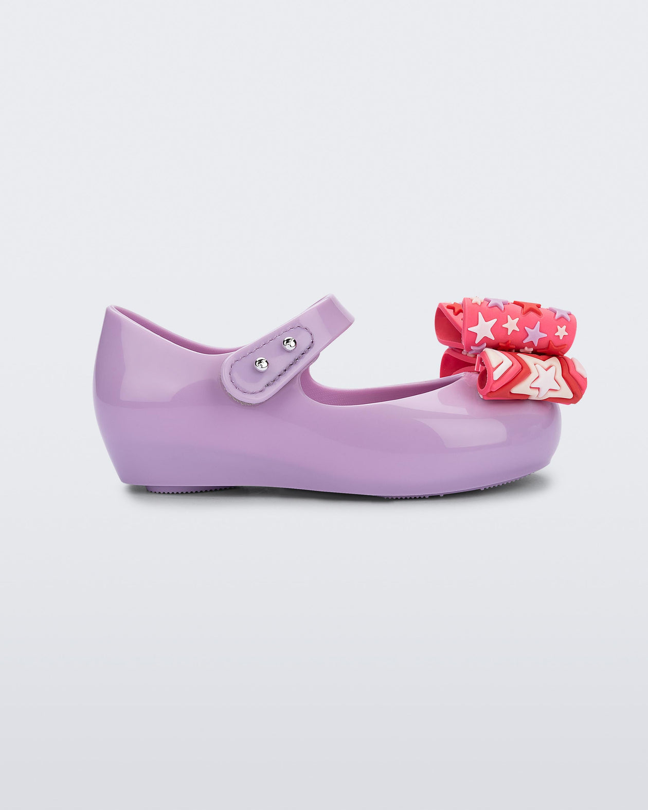 Side view of a lilac with pink patterned bow Ultragirl Wonderland baby flat