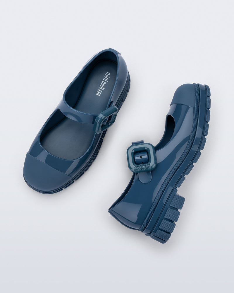 Top and side view of a pair of blue June mary janes with matte toe cap