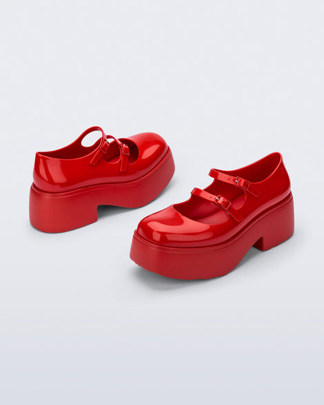 Back and front angled view of a pair of red Farah platform mary janes