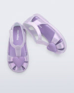 Side and top view of a pair of lilac Hip Heart Ballerina baby sandals with heart on front