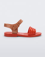 Side view of a red Mar Wave kids sandal with brown strap.