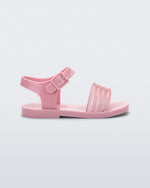 Side view of a pink Mar Wave baby sandal.