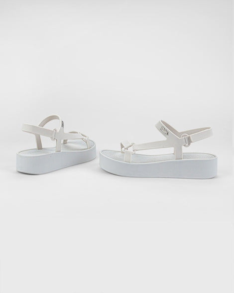 Angled side and back view of a pair of white Sun Downtown Platform sandals