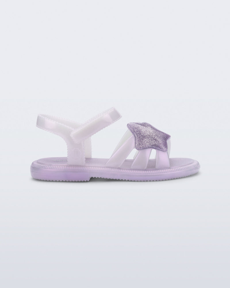 Side view of a pearly purple Hip Sky baby sandal with a glitter purple star on top