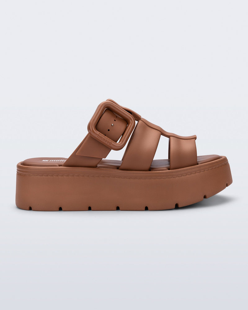 Side view of a brown Pump Platform sandal