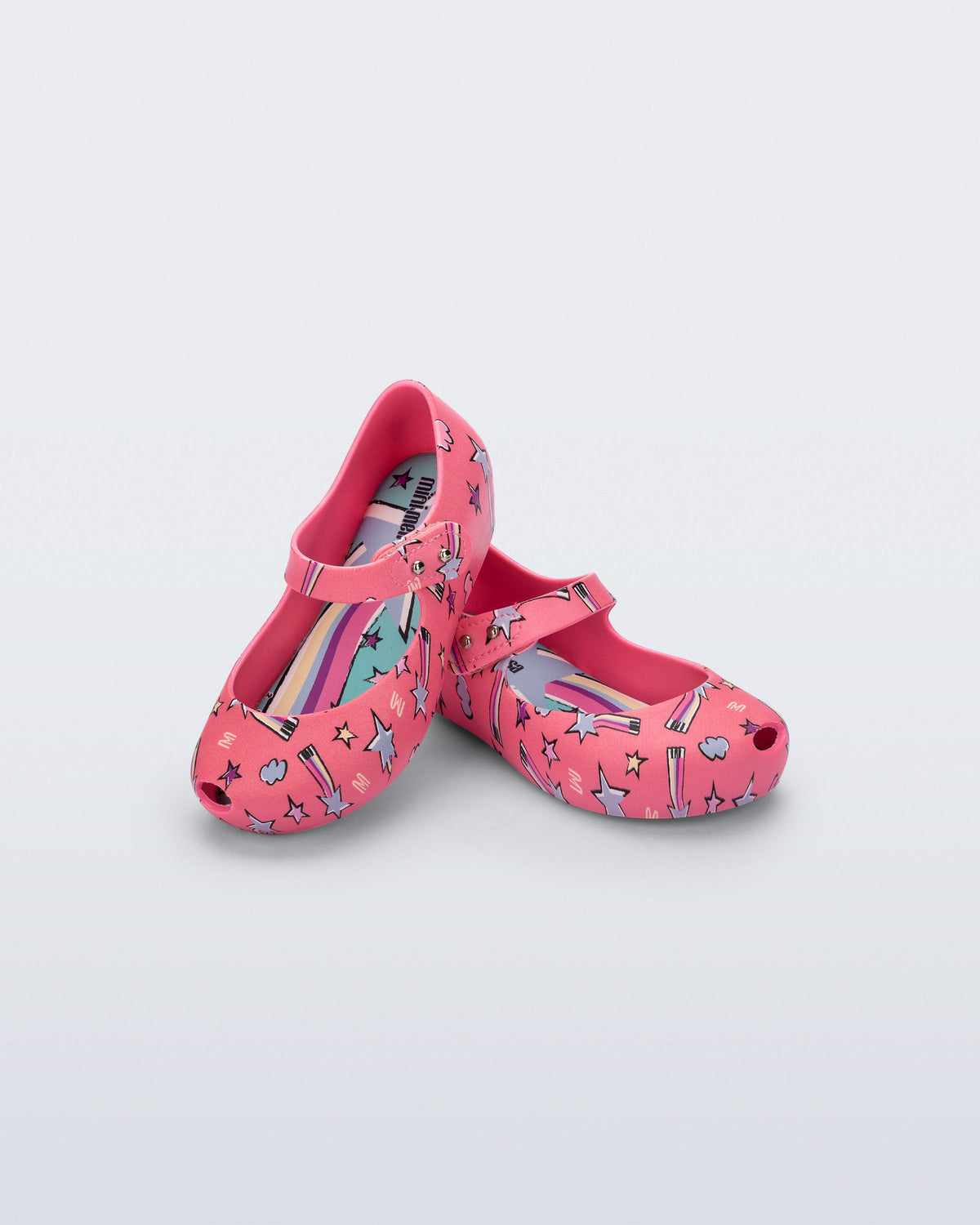 Angled view of a pair of pink Ultragirl Colors baby flats with shooting stars