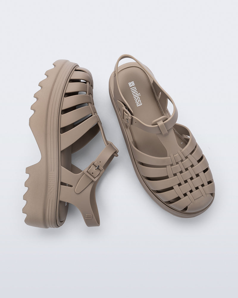 Top and side view of a pair of dark beige Possession Platform II sandals
