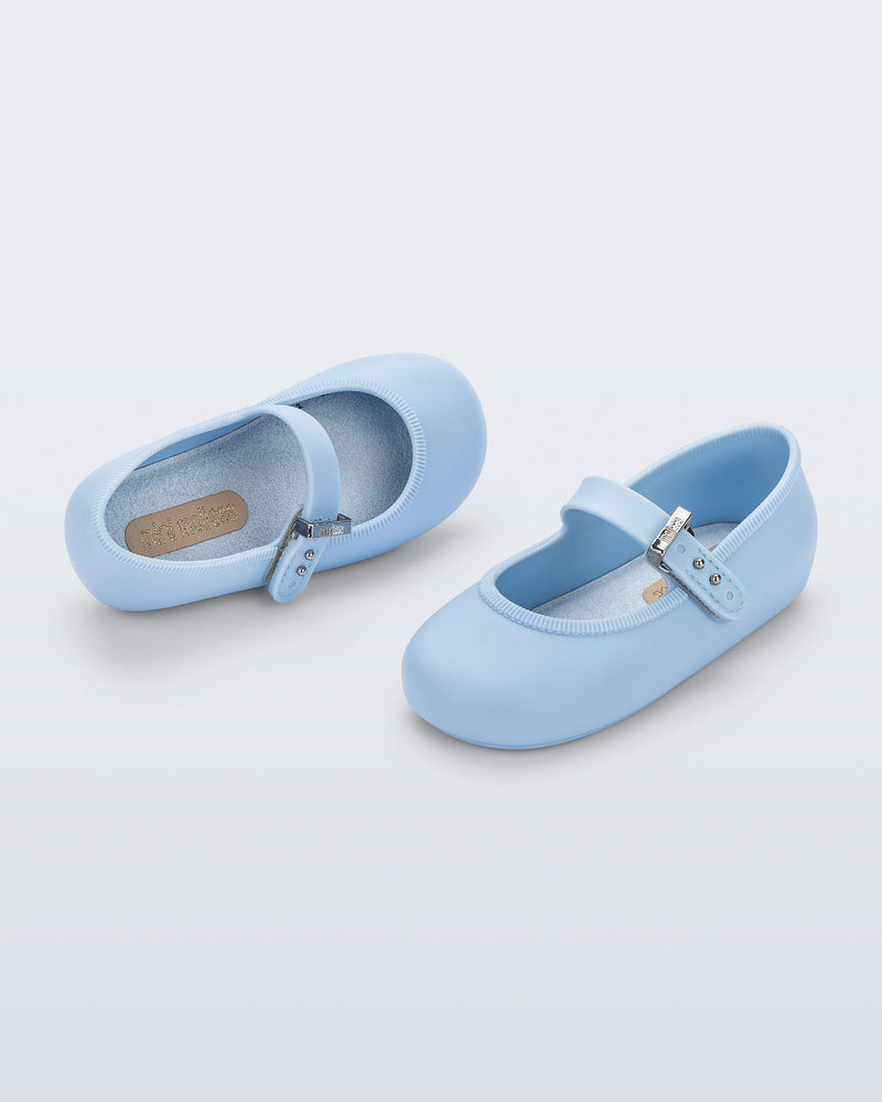 Side and top angled view of a pair of blue Soft Ballerina baby flats