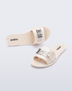 Top and angled view of a pair of beige Babe M Chic slide sandals